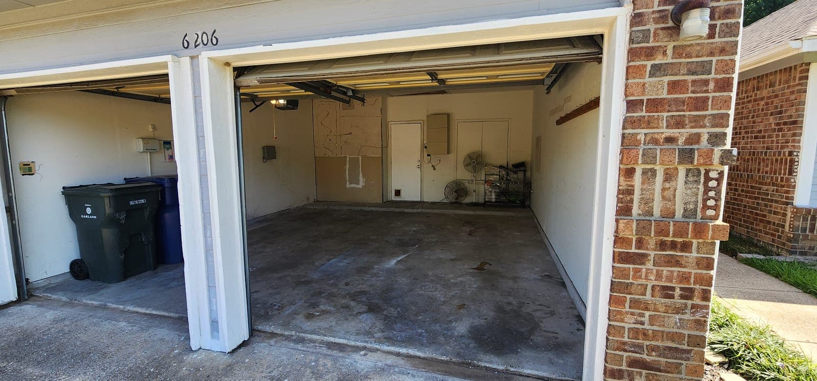 Packed garage bay — after